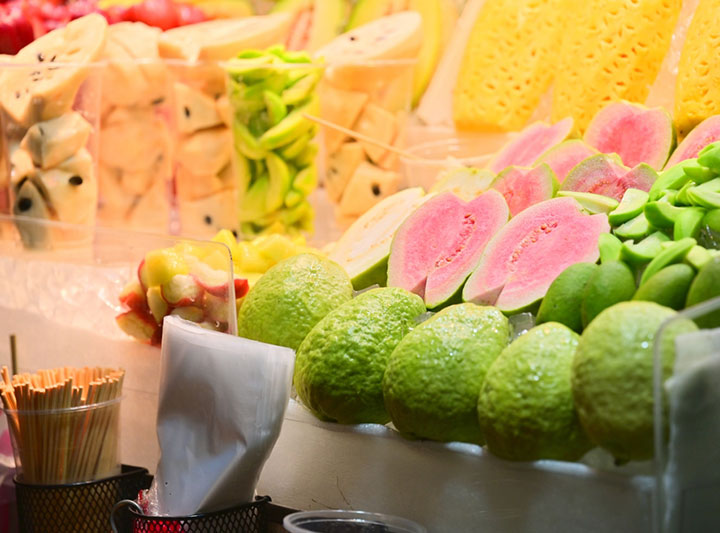 At Taiwan's night markets, you'll find stalls selling fresh red guavas, along with pre-cut pineapples, sugar apples, green mangoes, wax apples, and pineapples, among other fruits.